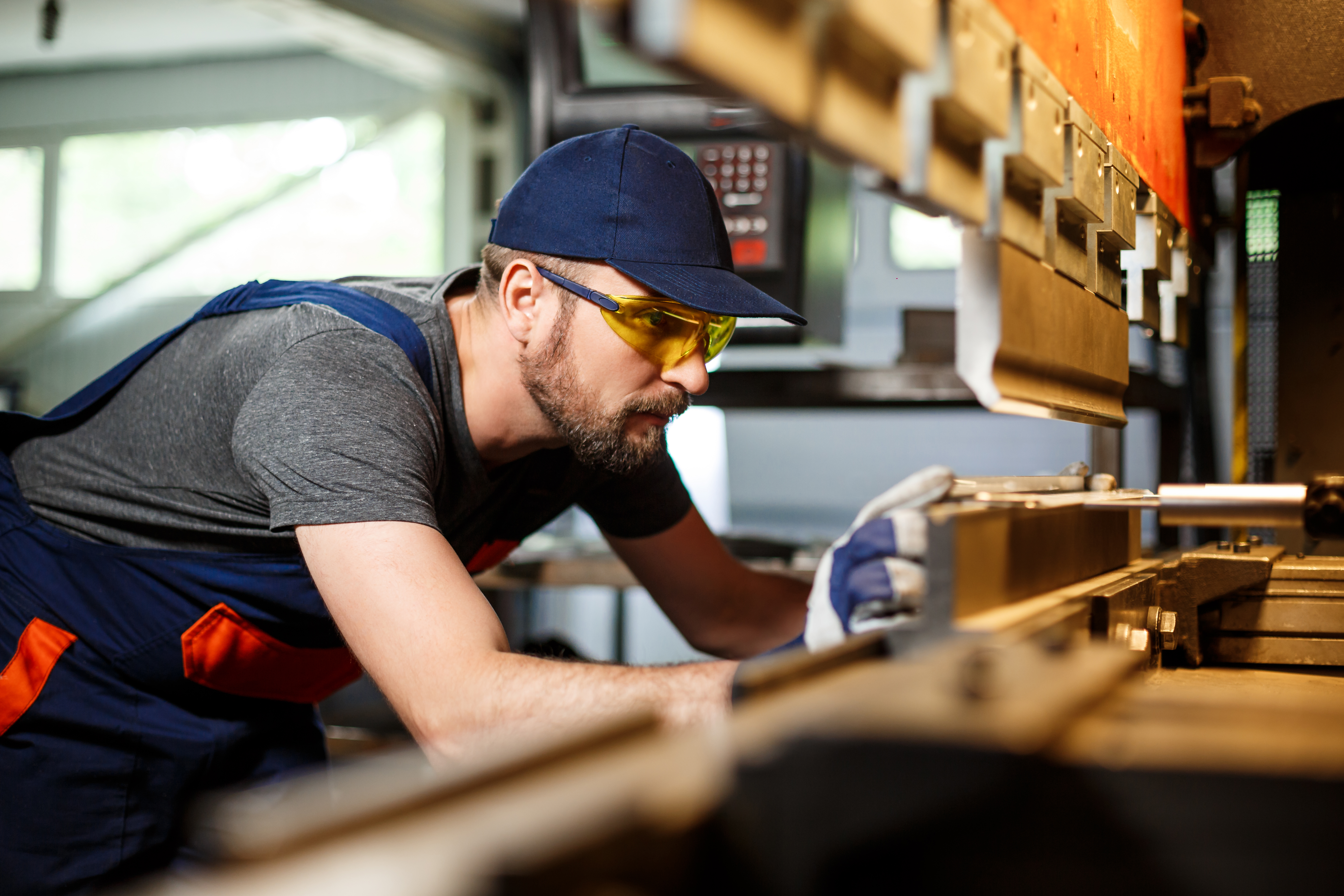 Portrait of worker near metal working machine